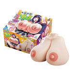 KMP Maji Hada Minami San Sensational Gigantic Tits — product front view with retail box behind; soft TPE breast form shown in studio lighting for scale and surface detail.